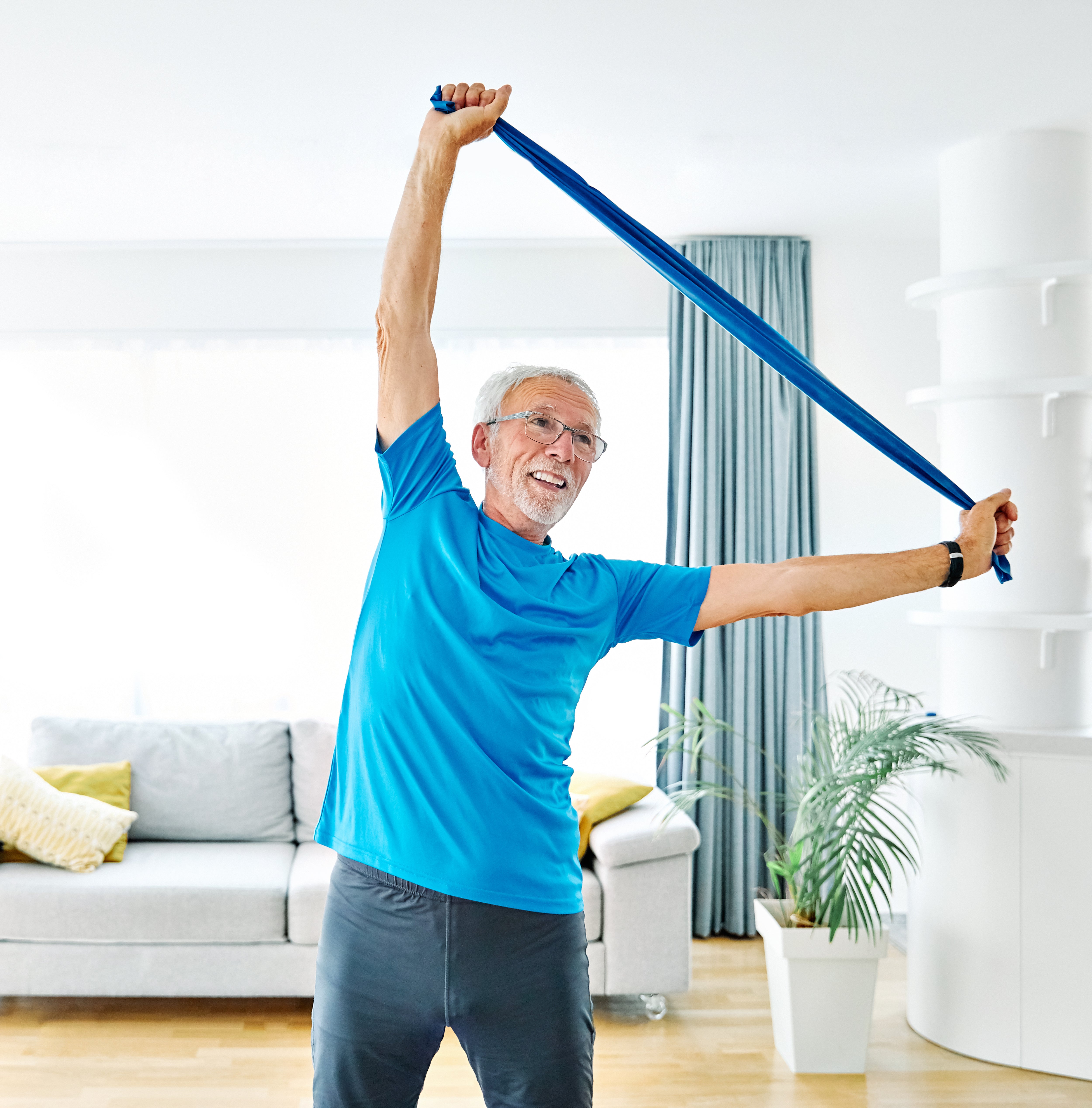 Woman using a flexa.fit resistance band for pilates and mobility at home