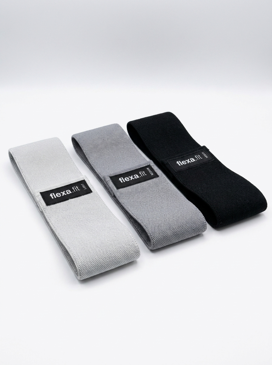 Studio shot of flexa.fit fabric glute resistance bands in light grey, dark grey and black