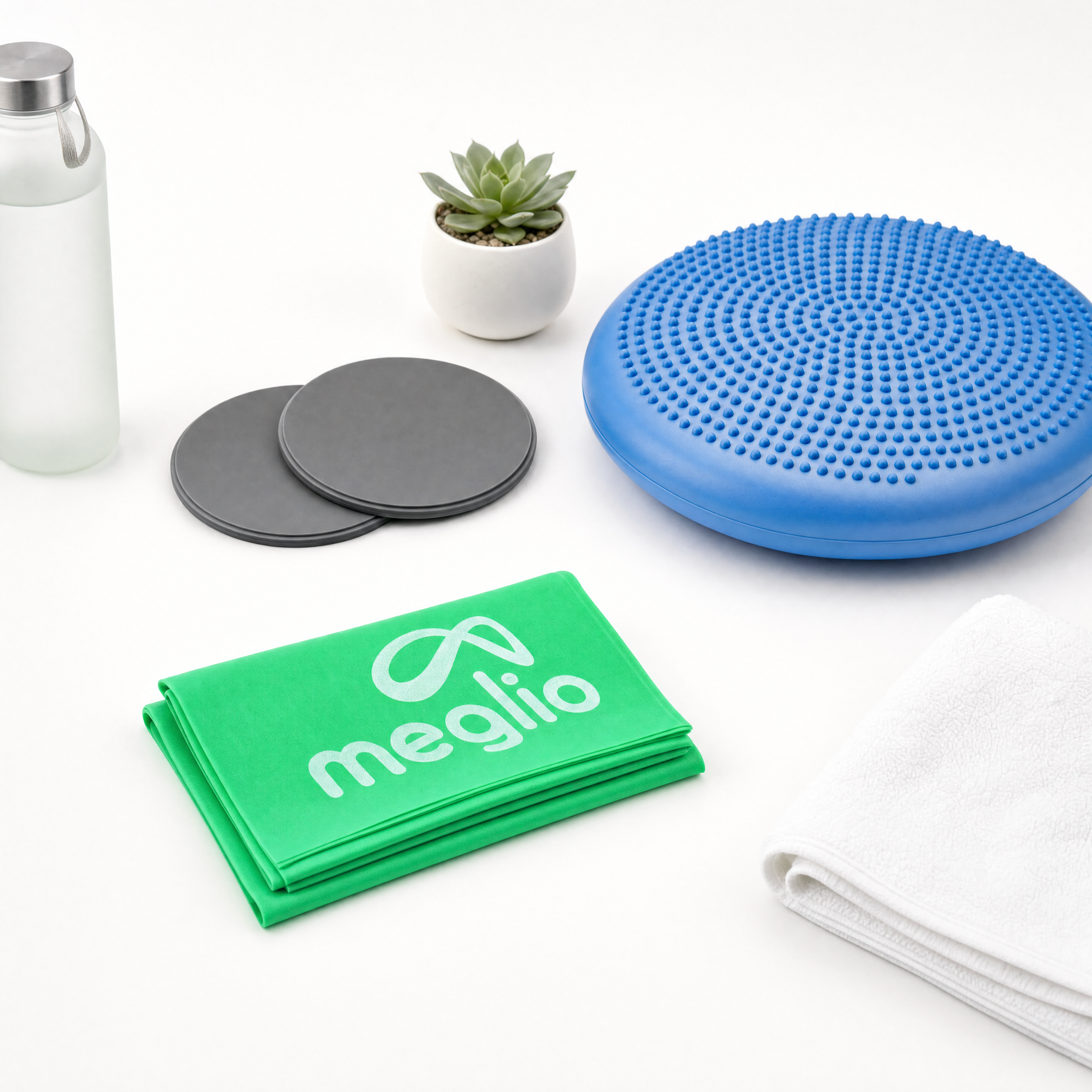flexa.fit Core and Balance Kit, the blue wobble cushion with a pair of core sliders and a folded resistance band