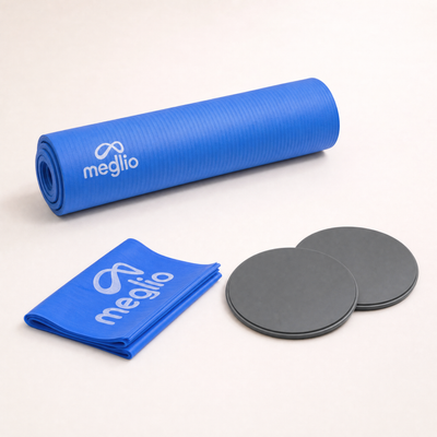 flexa.fit Home Fitness Kit laid out, the 10mm yoga mat rolled with a folded resistance band and two core sliders