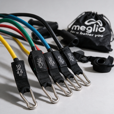 Close-up of the five resistance tube labels and metal clips beside the Meglio carry bag