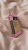 Close view of the pink MUTU Resistance Loop in its kraft sleeve